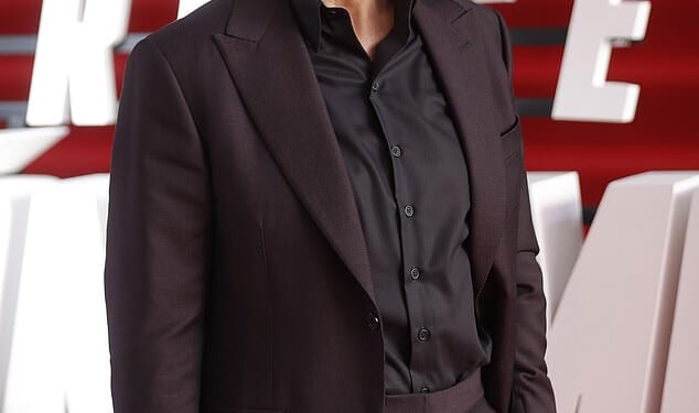 Tom Cruise 's fellow Scientologists blared bagpipe music at protesters as they looked to drown them out them as the Hollywood star jetted in to their UK headquarters