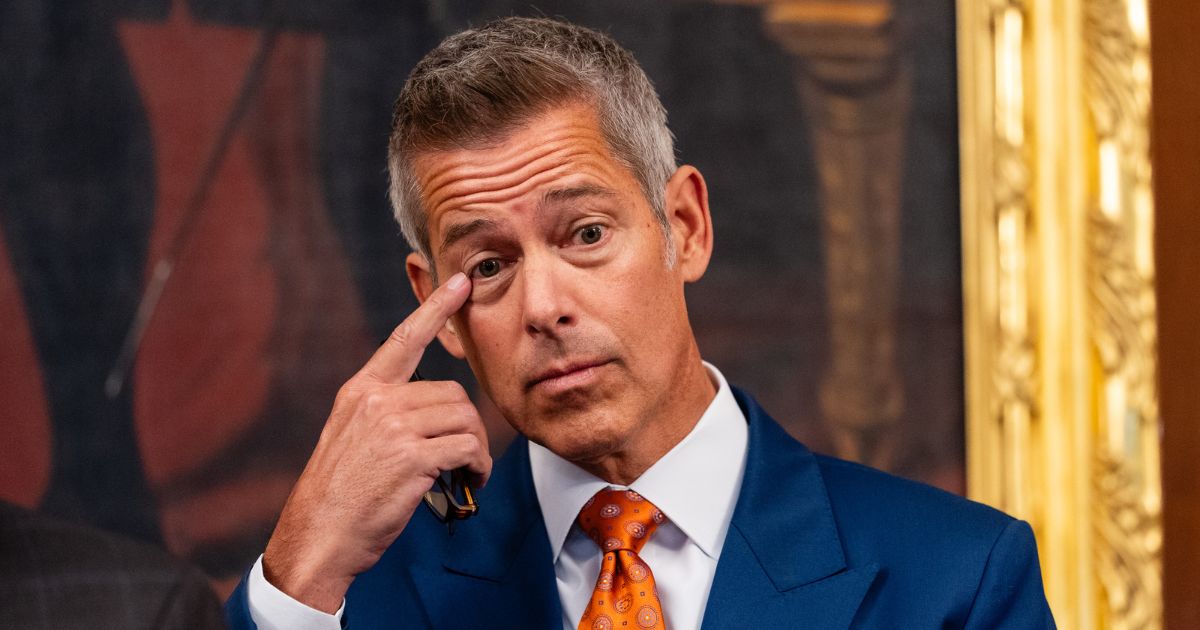 Transportation Secretary Sean Duffy touches his face during a news conference in the U.S. Capitol on Oct. 23, 2025 in Washington, DC.