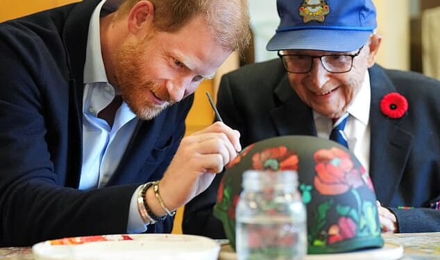 Harry painted poppies on an army helmet with 101-year-old veteran Jim LaForce who served in the Royal Canadian Air Force during World War Two