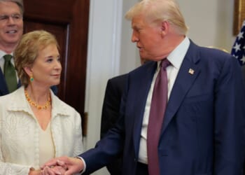 President Donald Trump speaks with Secretary of Education Linda McMahon during an executive order signing ceremony in the Roosevelt Room of the White House on July 31, 2025, in Washington, D.C.