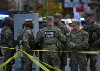 National Guard soldiers gather near a crime scene after a shooting in downtown Washington, D.C., on Nov. 26, 2025.