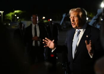 President Donald Trump speaks to reporters before boarding Air Force One at Palm Beach International Airport in West Palm Beach, Florida, on Nov. 16, 2025.