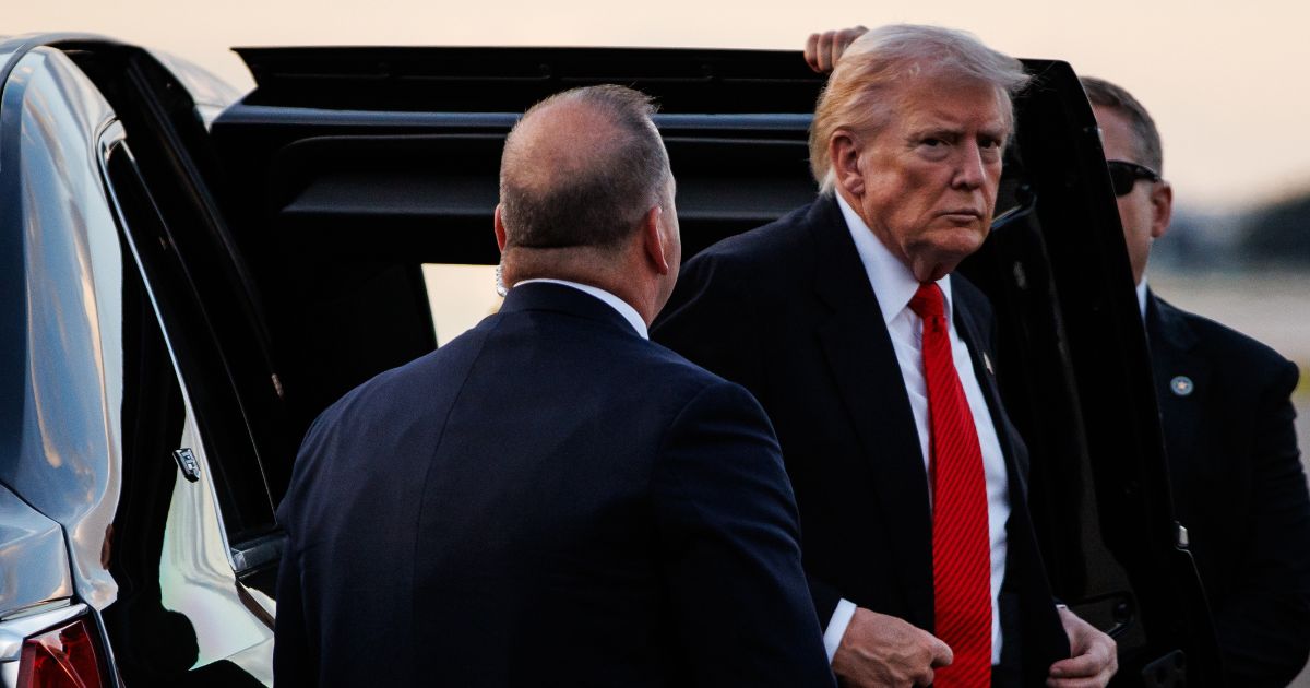 President Donald Trump steps out of the presidential limousine before boarding Air Force One en route to the White House on Nov. 2, 2025, at Palm Beach International Airport in West Palm Beach, Florida.
