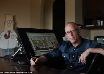 Dilbert creator Scott Adams (pictured) has asked Donald Trump to help save his life as he suffers from prostate cancer