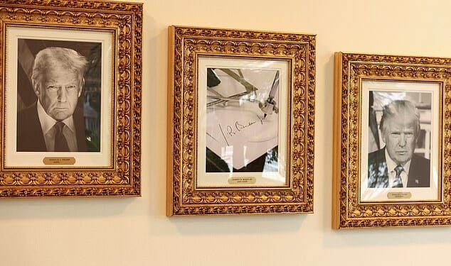 An image of an autopen signing former U.S. President Joe Biden's signature is displayed in place of a portrait Biden next to portraits of U.S President Donald Trump at the "Presidential Walk of Fame" along the Colonnade at the White House