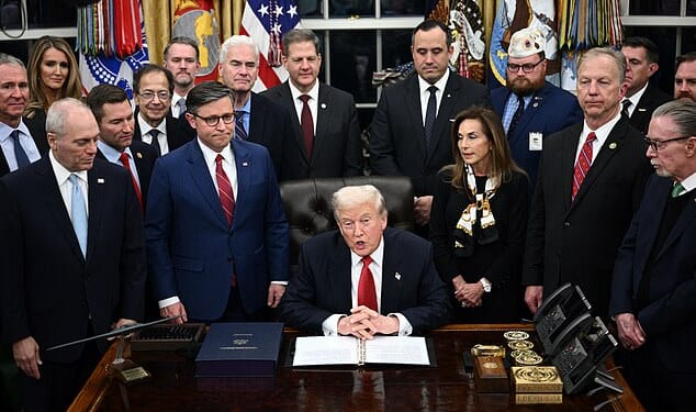 US President Donald Trump (C) speaks while signing the bill package to open the federal government in the Oval Office of the White House in Washington, DC, on November 12, 2025