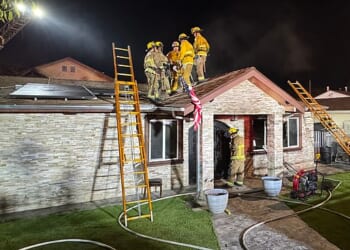 A late-night house fire in Sunland claimed the lives of two people and sent five others to the hospital
