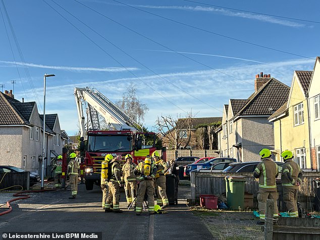 Firefighters on Holywell Avenue in Ashby-de-la Zouch, Leicestershire, this morning