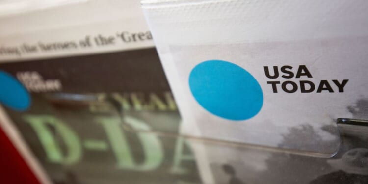 A copy of a special edition of USA Today sits in a display at a convenience store in Washington, DC on Aug. 6, 2019.