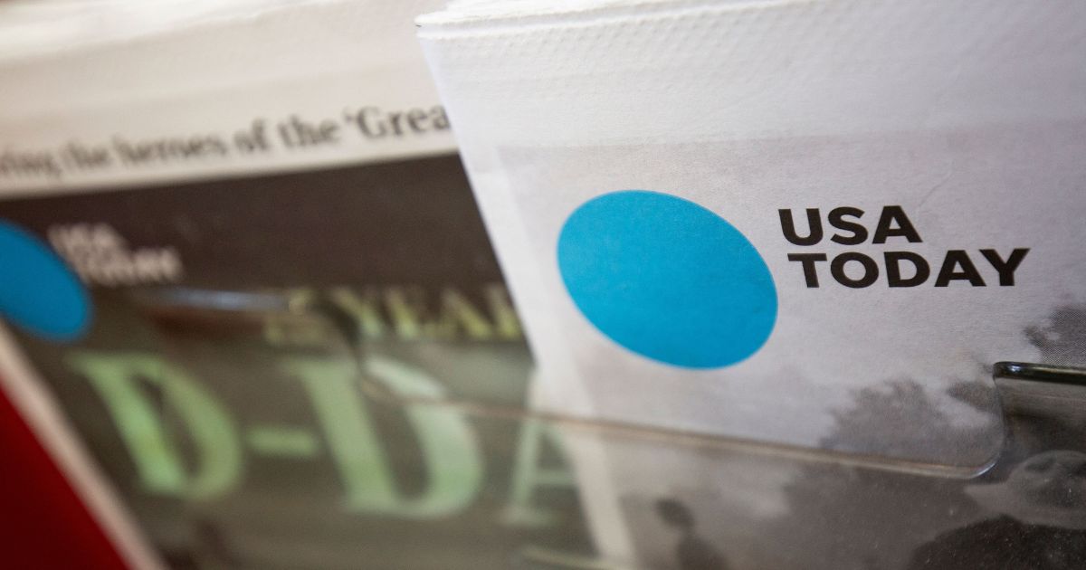 A copy of a special edition of USA Today sits in a display at a convenience store in Washington, DC on Aug. 6, 2019.