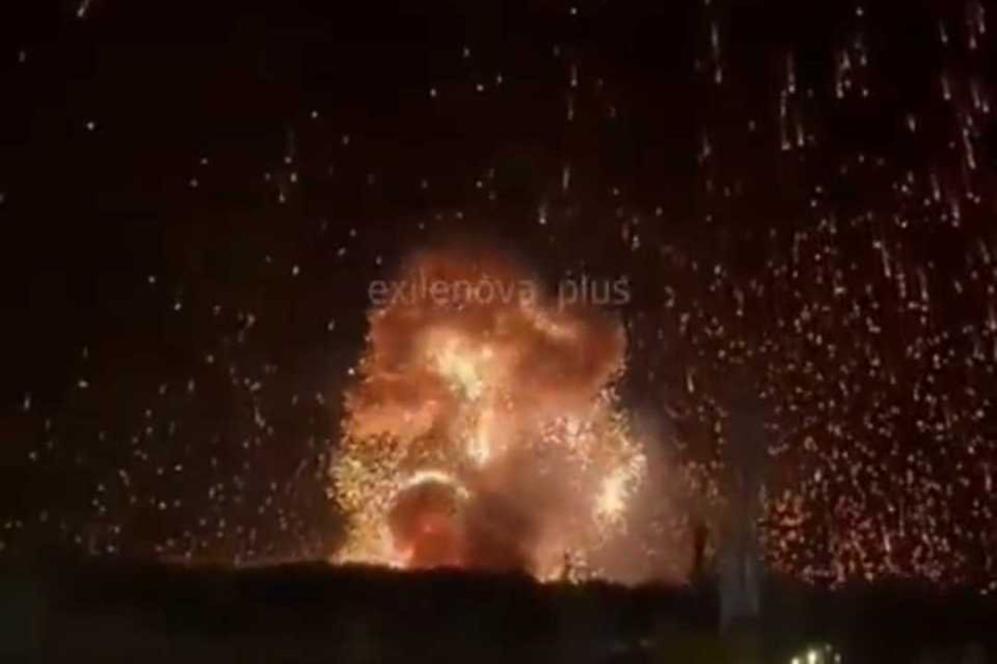 An image collage containing 1 images, Image 1 shows Nighttime explosion with sparks showering down