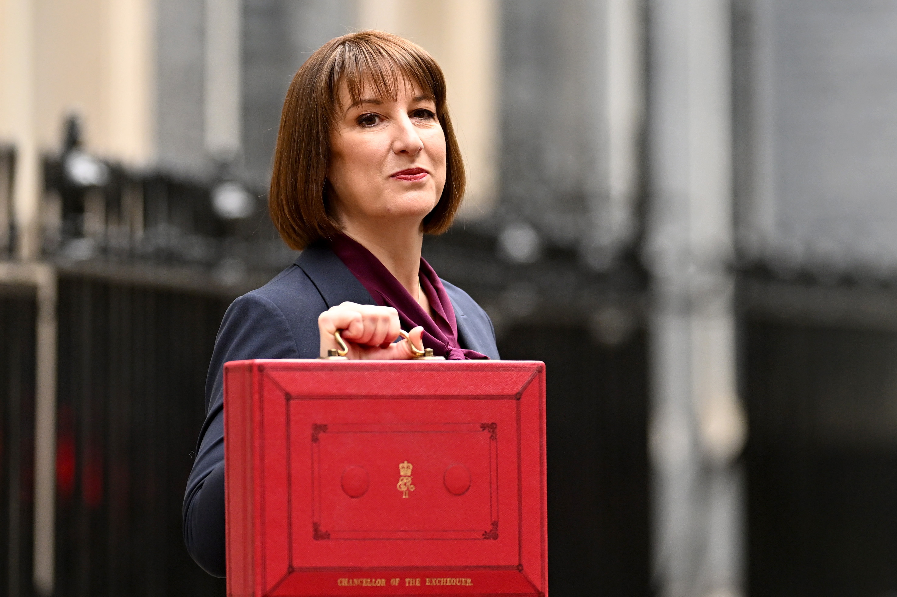 Rachel Reeves, Chancellor of the Exchequer, holding the red Budget Box.