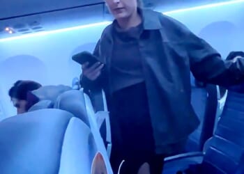 A blonde woman was seen repeatedly shouting a vulgar slur at airline crew members and passengers while on board a United Airlines flight on November 9 in Newark, New Jersey