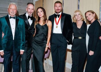 Victoria Beckham's rarely-seen brother Christian (second from left), has been pictured in a picture shared by his sister Louise as the family celebrated brother-in-law David's knighthood