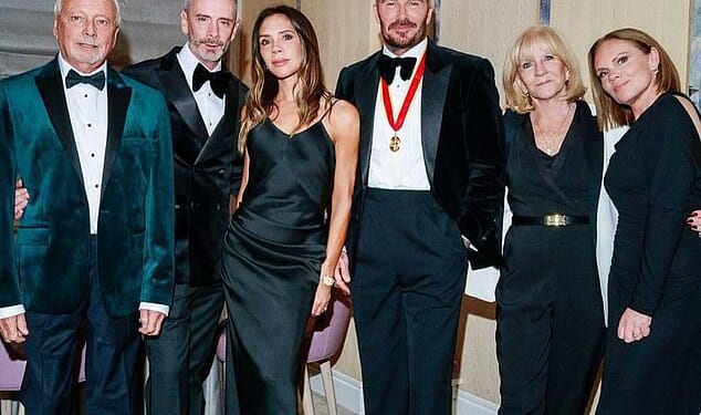 Victoria Beckham's rarely-seen brother Christian (second from left), has been pictured in a picture shared by his sister Louise as the family celebrated brother-in-law David's knighthood