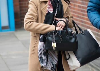 Karen Baker, 59, of Lincoln, East Midlands, admitted being drunk on an aircraft, racially aggravated harassment and using threatening or abusive words to cause harassment, alarm, or distress