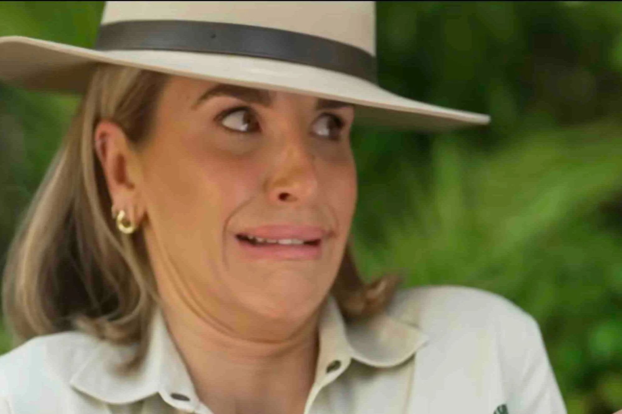 An image collage containing 1 images, Image 1 shows Vogue Williams looking distressed in a cream shirt and hat