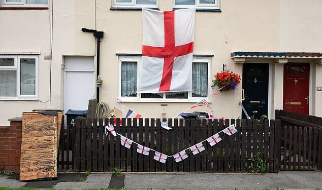 Flag crackdown: Local councils have spent at least £70,000 removing or taking down flags across the country, it has emerged. Pictured: Weoley Castle in Birmingham