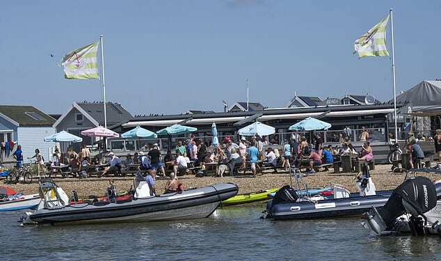 Wealthy beach hut owners claim The Beach House, pictured, is turning their pristine stretch of coast into a 'Magaluf rave scene'