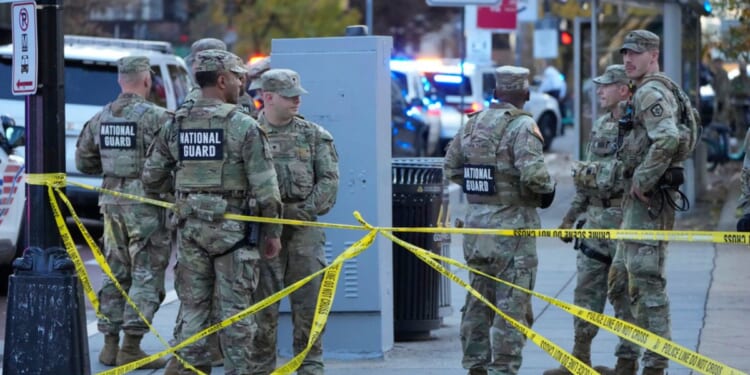 Members of the National Guard troops gather near the White House after reports of two National Guard soldiers being shot nearby in Washington, DC on Nov. 26, 2025.