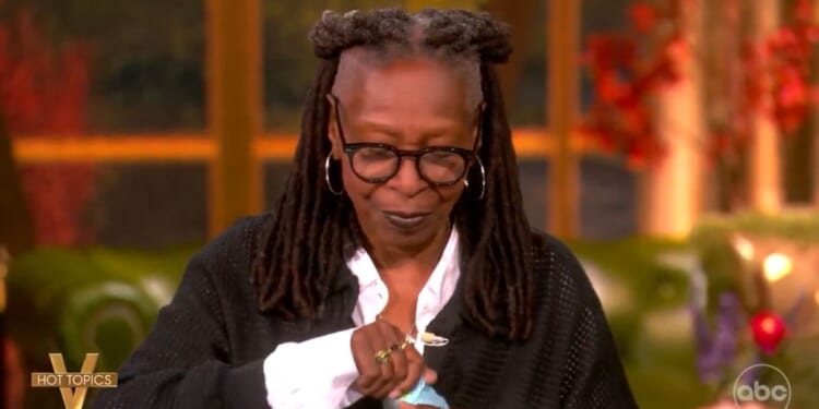 Whoopi Goldberg tears up a note that had been passed to her during Monday's episode of "The View," containing a clarification or correction of a statement she'd made about President Donald Trump.