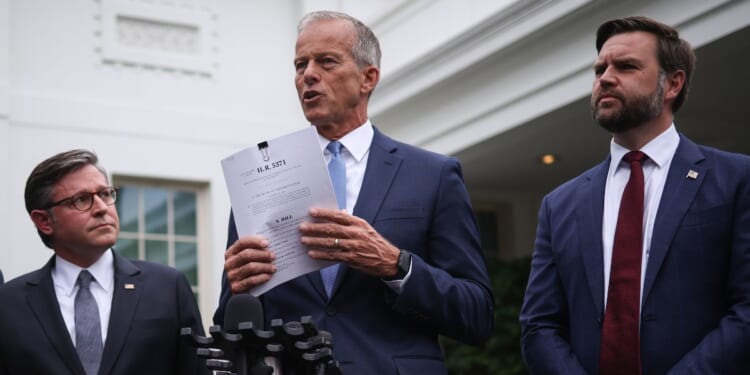 Senate Majority Leader John Thune holds a copy of a funding bill as he delivers remarks following a meeting with Congressional Democrats and President Donald Trump at the White House on Sept. 29, 2025, in Washington, D.C.