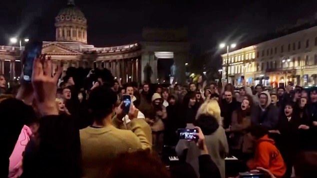 A massive crowd was seen joining street musicians at Kazanskaya Square to sing banned anti-war lyrics on October 13