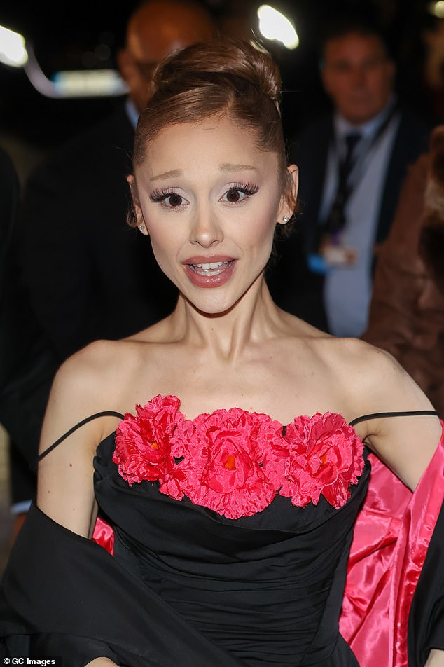Ariana Grande showed off her 40 hand 'prison' tattoos as she stepped out for the premiere of Wicked: For Good in Paris