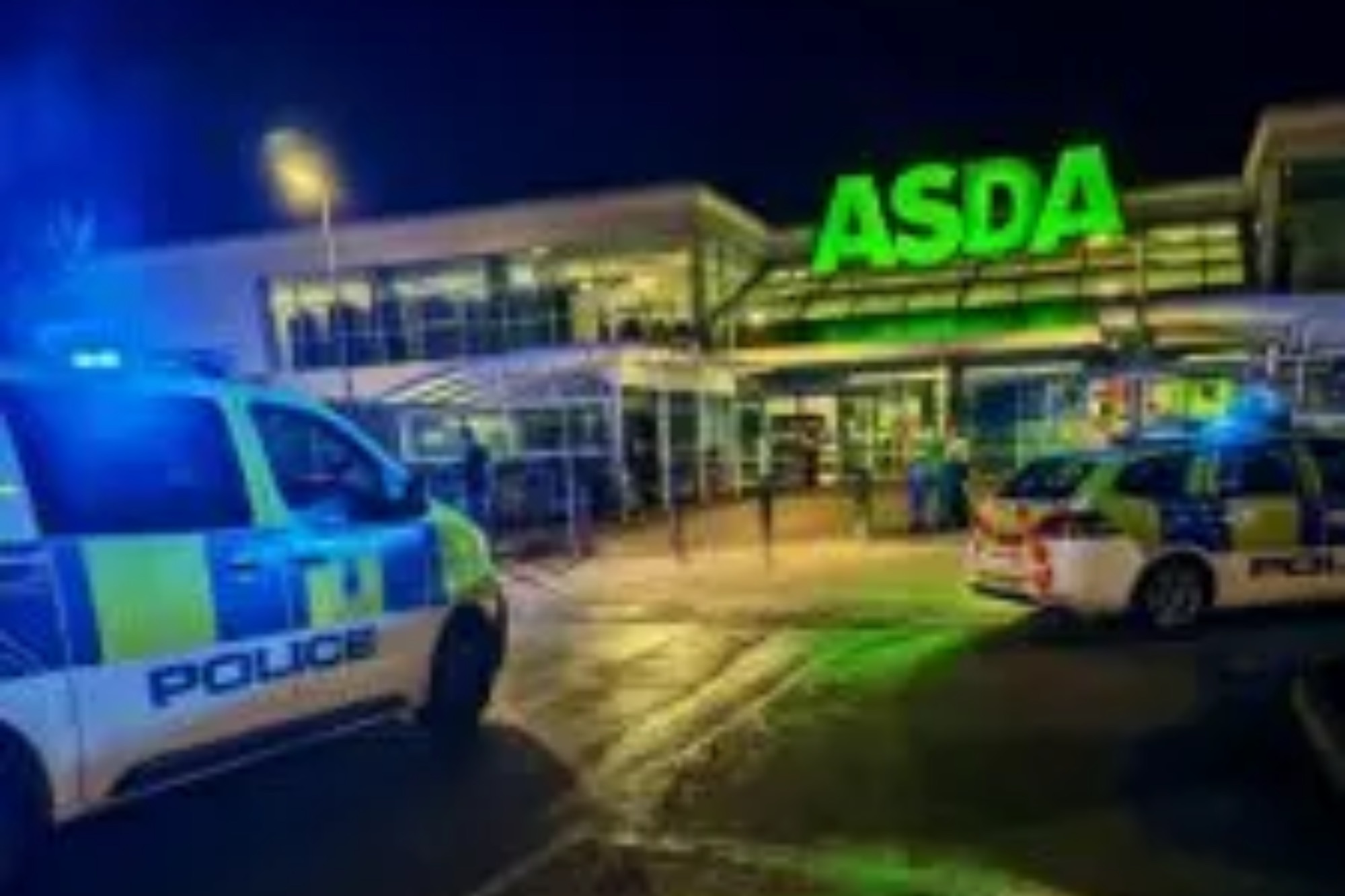 An image collage containing 1 images, Image 1 shows Two police cars parked outside an ASDA supermarket at night