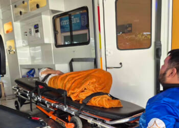 An emergency rescue team transports a woman discovered to be alive Sunday after being transported to a cremation facility at a Buddhist temple in Nonthaburi province, Thailand.