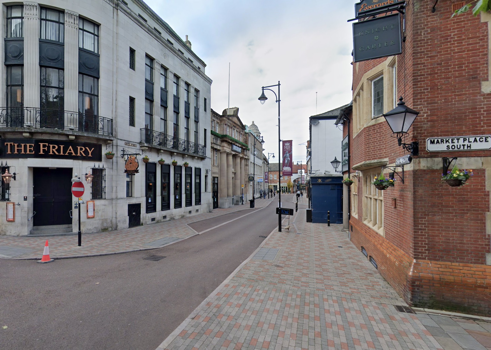 A street scene featuring "The Friary" pub on the left and a building with "Knight & Garter" signage on the right.