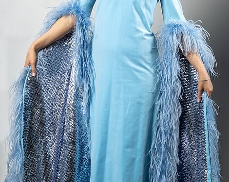 Cilla Black's iconic velvet ballgown is tried on by Daily Mail news reporter Katherine Lawton (pictured). Price at auction: £350-£550