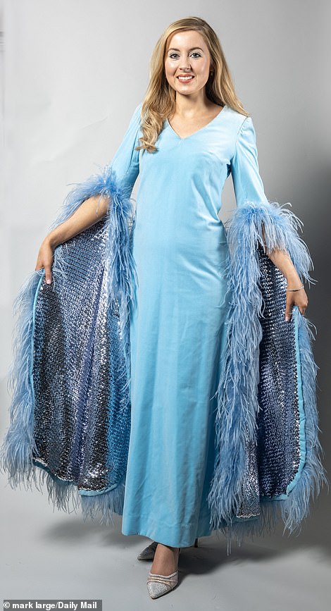 Cilla Black's iconic velvet ballgown is tried on by Daily Mail news reporter Katherine Lawton (pictured). Price at auction: £350-£550