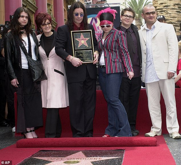Ozzy died of heart failure aged 76 at his Buckinghamshire home on July 22. The late singer poses with his family in 2002. Pictured from left are Aimee, Sharon, Kelly, Jack and Louis