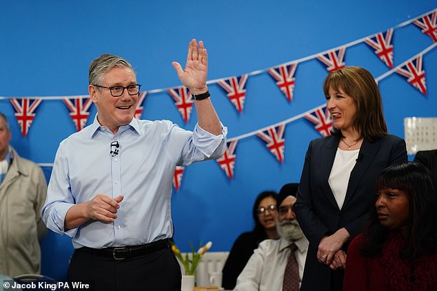 Chancellor Rachel Reeves is seen standing next to Prime Minister Sir Keir Starmer at the Benn Partnership Centre, a community centre in Rugby, Warwickshire, on November 27 2025