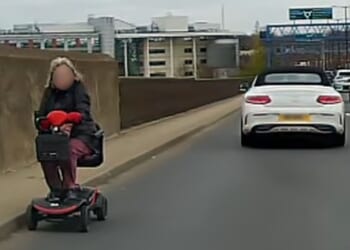 Astonishing moment mobility scooter speeds wrong way down major A-road as drivers swerve to avoid it