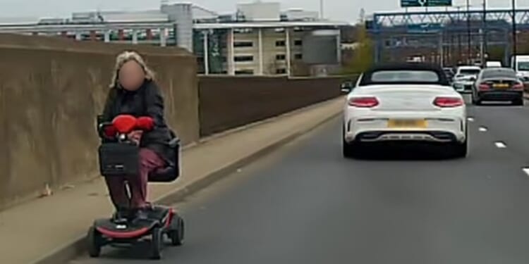 Astonishing moment mobility scooter speeds wrong way down major A-road as drivers swerve to avoid it