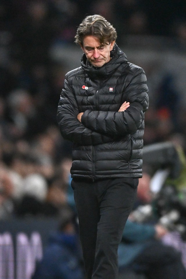 Thomas Frank looking dejected during a Premier League match between Tottenham Hotspur and Chelsea.