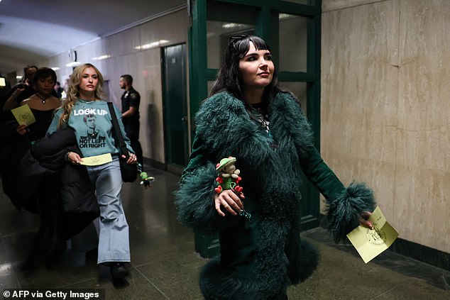 A catwalk of Mangione's most ardent fans were seen strutting into the courtroom, wearing a selection of merchandise supporting the alleged killer and vying for his attention