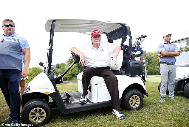Trump waits on the ninth tee in his golf cart during the pro-am prior to the LIV Golf Invitational - Bedminster at Trump National Golf Club Bedminster on July 28, 2022