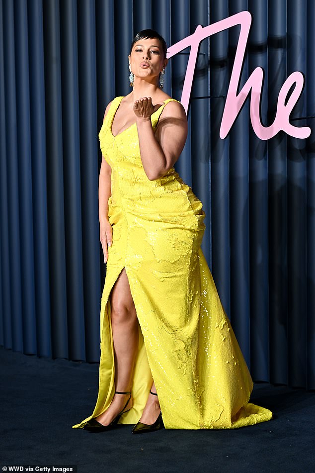 The model was in high spirits as she arrived for the awards in her colourful look