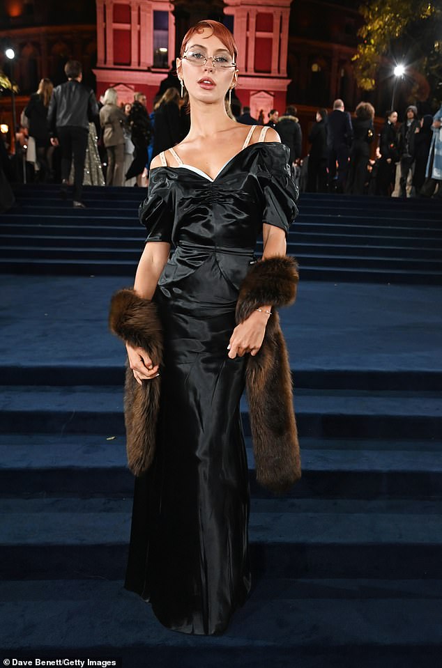 Iris Law sported a whole new look with her strawberry blonde hair and black satin dress