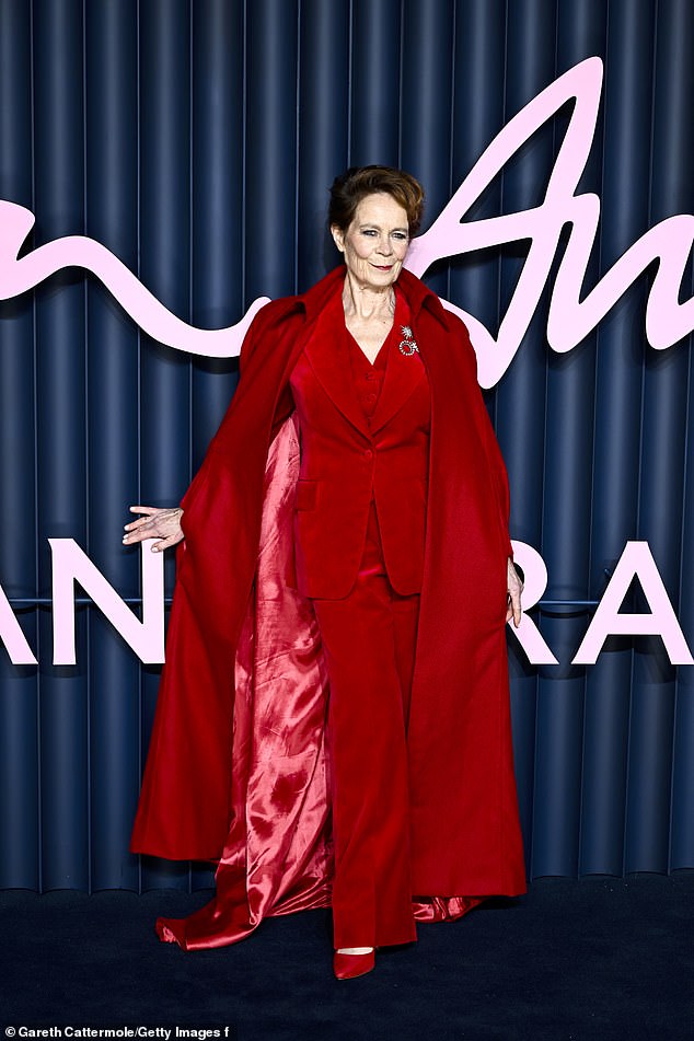 Celia Imrie was in the moment as she sported a red velvet suit, matching heels and a long coat which she swished around
