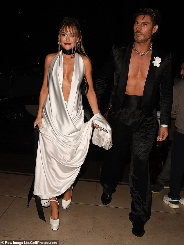 Make-up artist Chris Appleton flashed his bare chest as he arrived alongside a glam pal