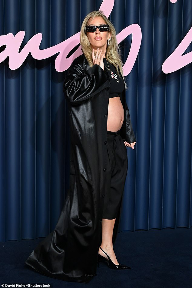 Ellie showed off her bare bump in a revealing black crop top and culottes as she arrived for the ceremony in London's Royal Albert Hall