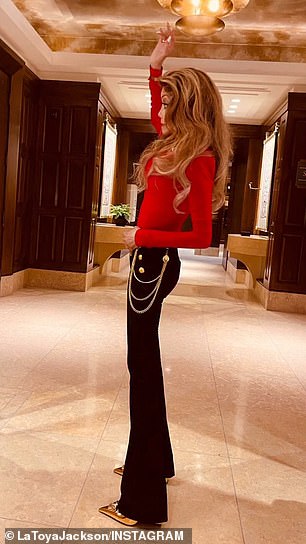 The 69-year-old shared three images of herself posing up a storm in a pair of tight black pants and a long-sleeved red top