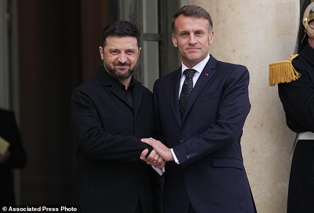 French President Emmanuel Macron, right, welcomes Ukrainian President Volodymyr Zelenskyy, Monday, December 1, 2025. Zelensky has indicated that he's open