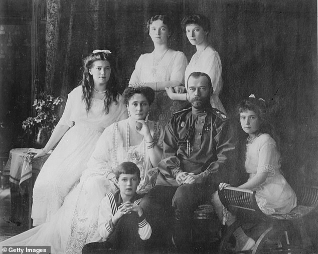 Tsar Nicholas and his wife, Empress Alexandra, with their three children, before the Russian revolution