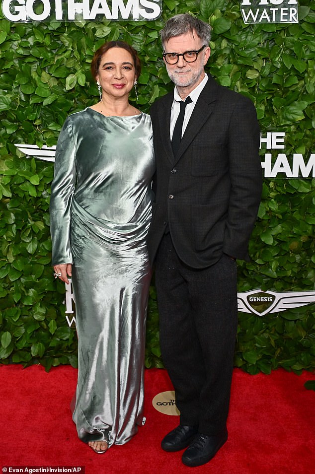 Maya Rudolph, 53, looked radiant in a ruched green long-sleeve gown while flashing a smile beside her film director spouse Paul Thomas Anderson, 55