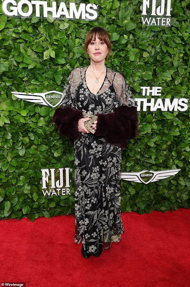 Molly Ringwald looked much younger than her 57 years as she made her way around the event in a sheer floral prink frock with glamorous fur sleeves